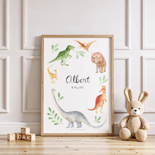 Framed dinosaur illustration with 'Albert' on a wall with a teddy bear and wooden blocks below.