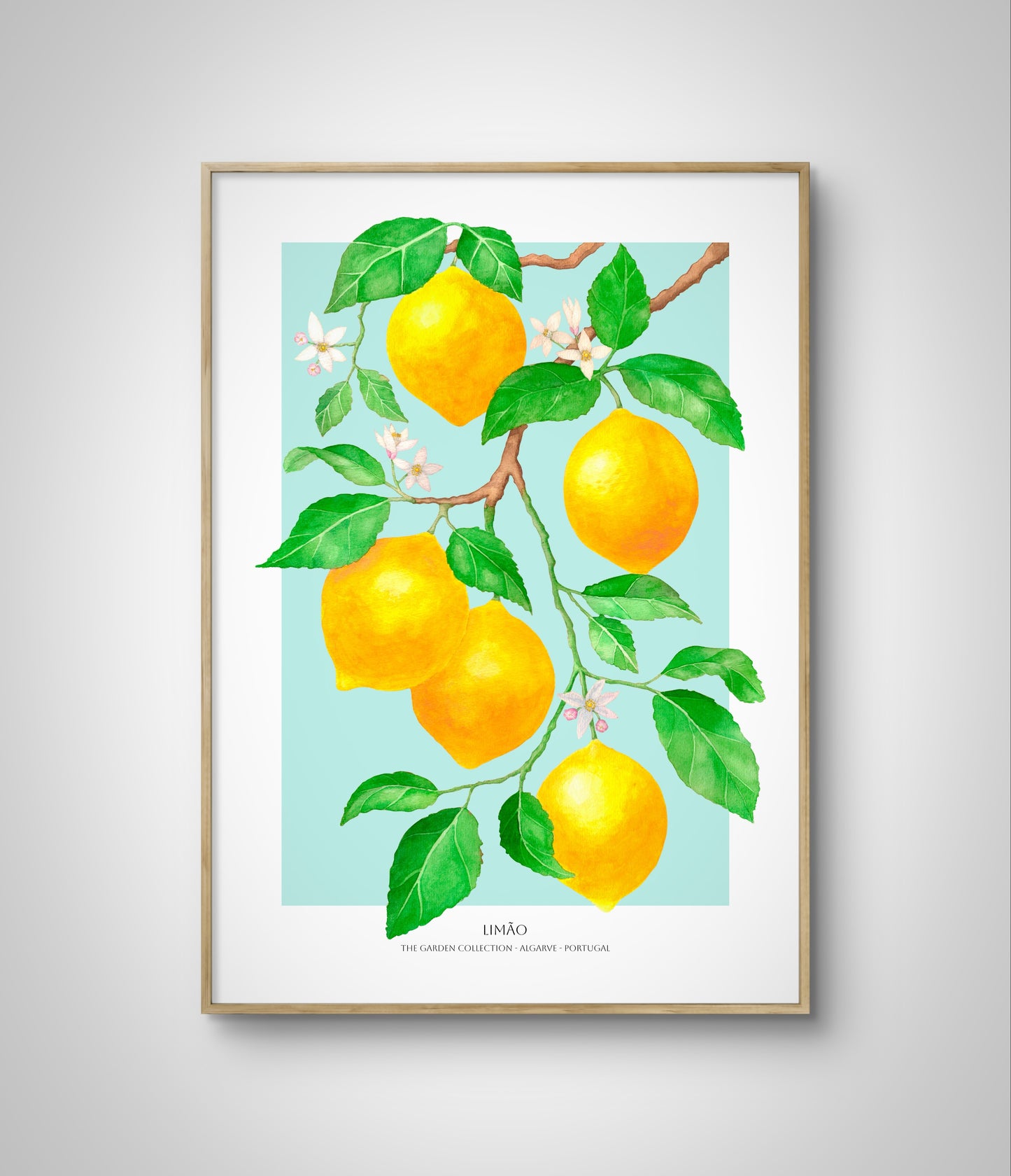 Framed fruit poster with lemons on blue background hanging on white wall