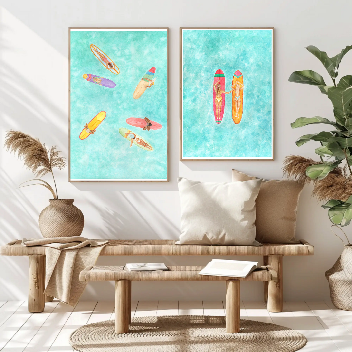 Two framed surf art prints with women surfers on long boards hanging side by side on wall above wooden bench in aesthetic room with bali vibes