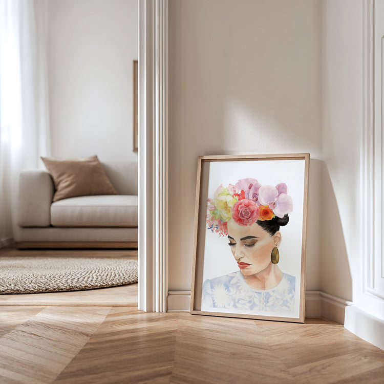 Three fine art prints in wooden frames of watercolour portraits of women with flowers in their hair