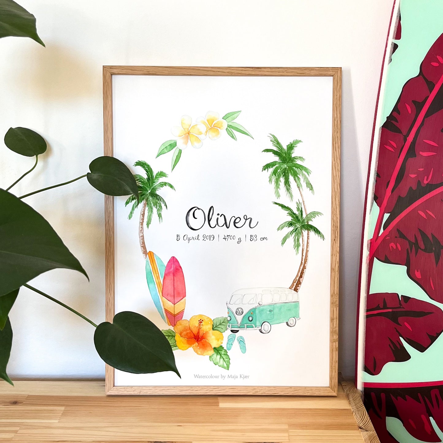 Framed artwork with palm trees, surfboards, and a car on a white background