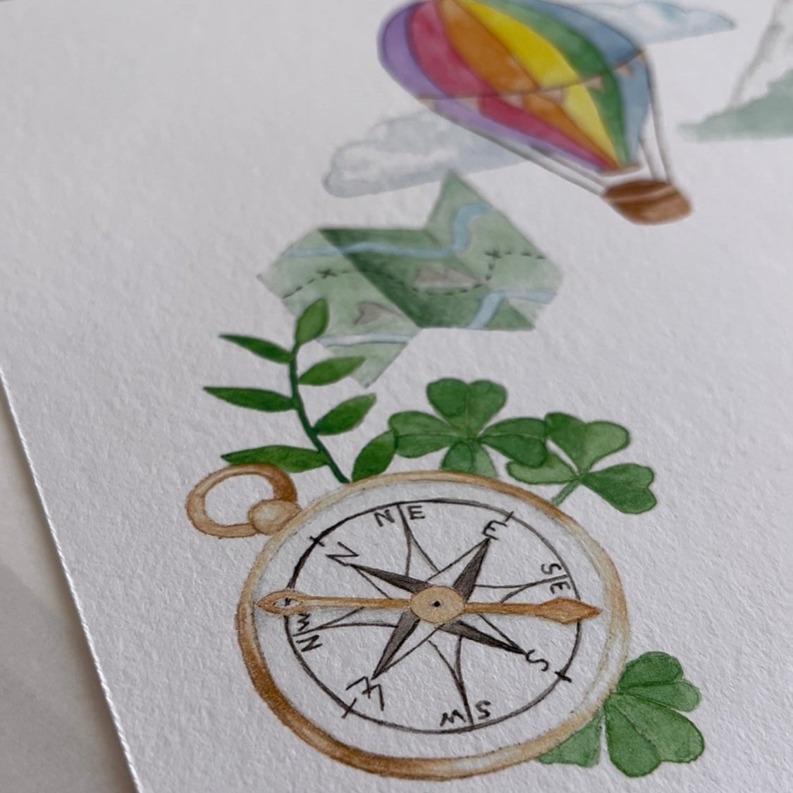 Custom baby name poster with compass, trees, and hot air balloon design on a white background