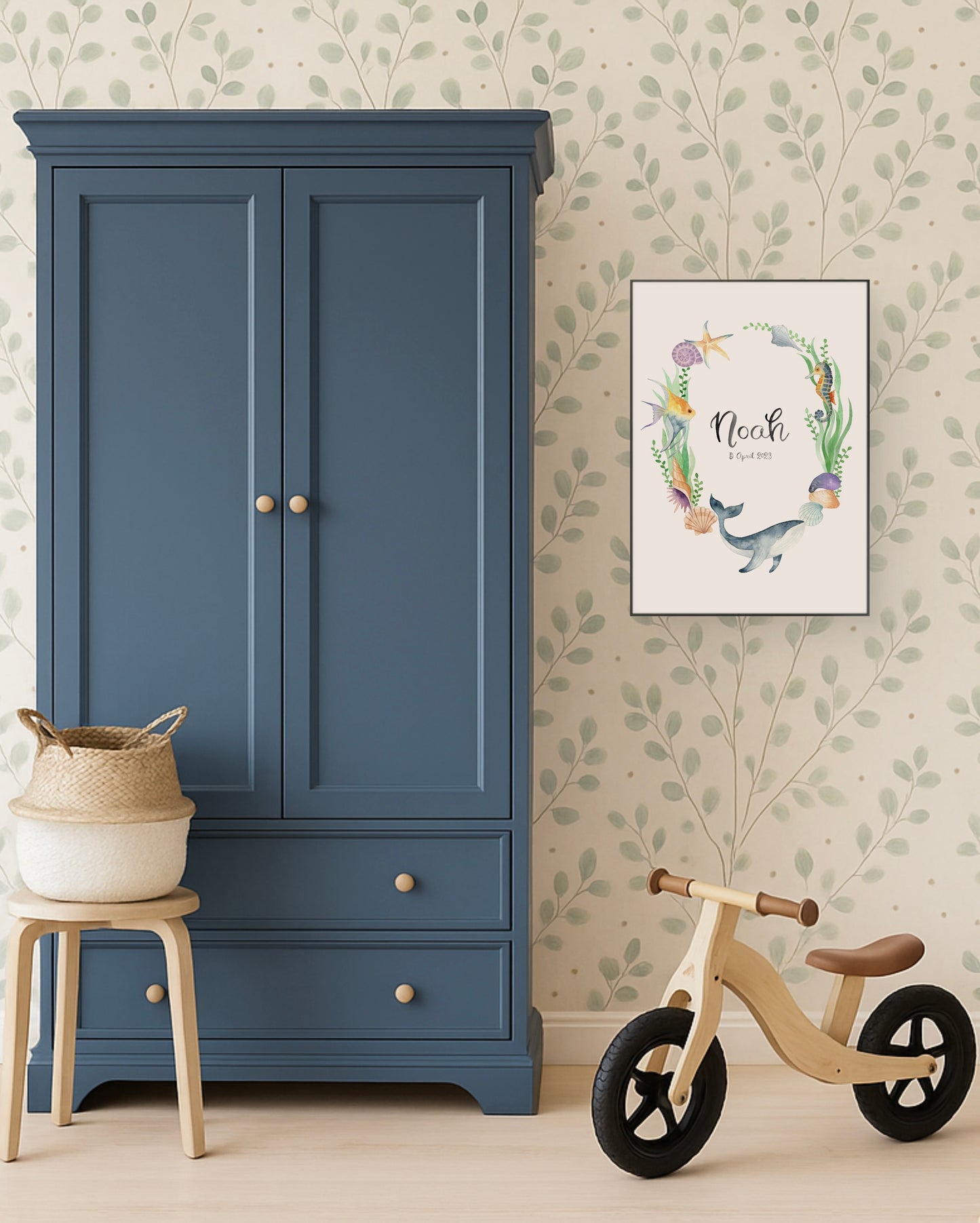 Blue wardrobe with a wooden stool and balance bike in a room with floral wallpaper.