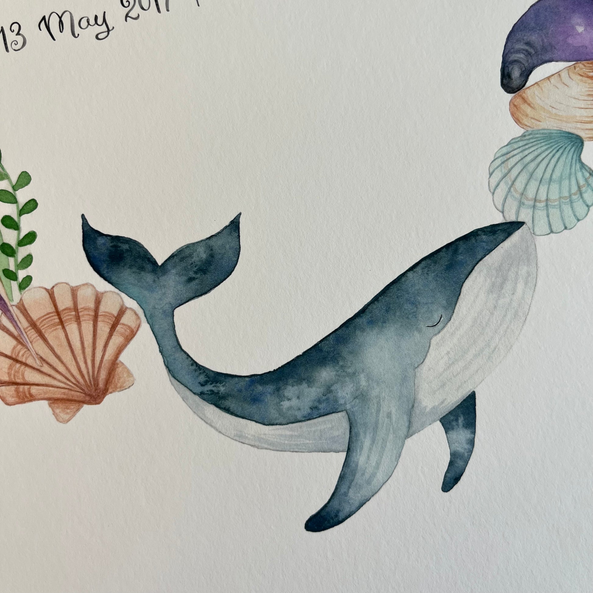 baby name poster Illustration of a whale surrounded by seashells and seaweed on a light background