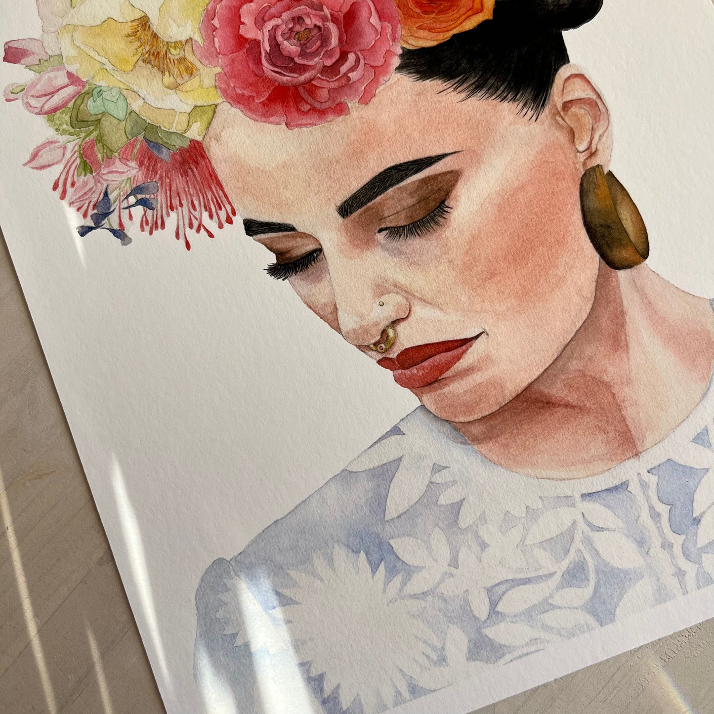 Artistic illustration of a woman with flowers in her hair on a white background