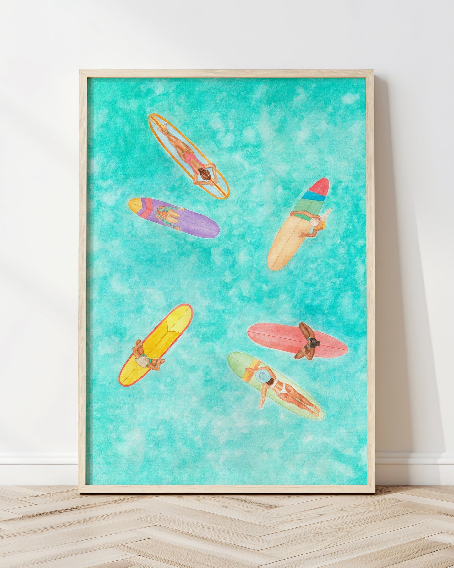 Framed artwork of colorful surfboards on a turquoise background