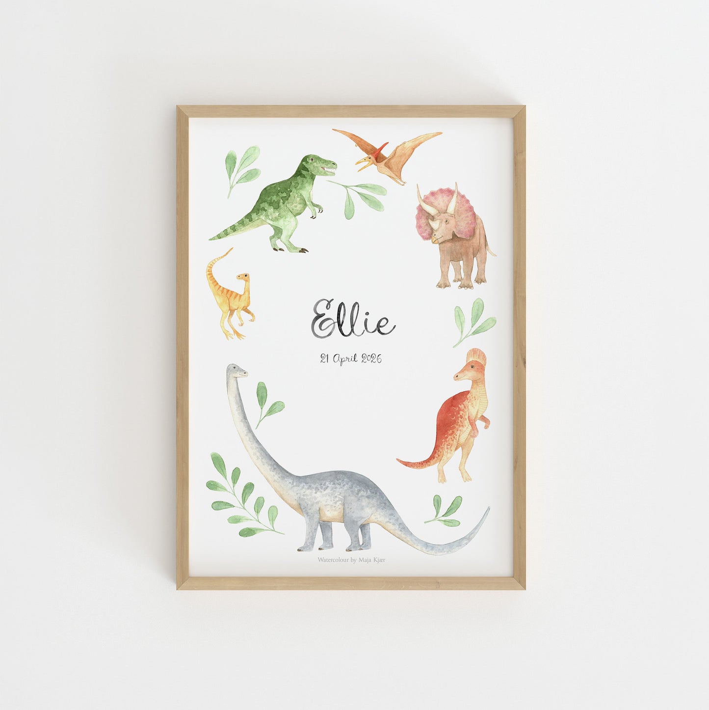 Framed print with dinosaur illustrations on a white wall
