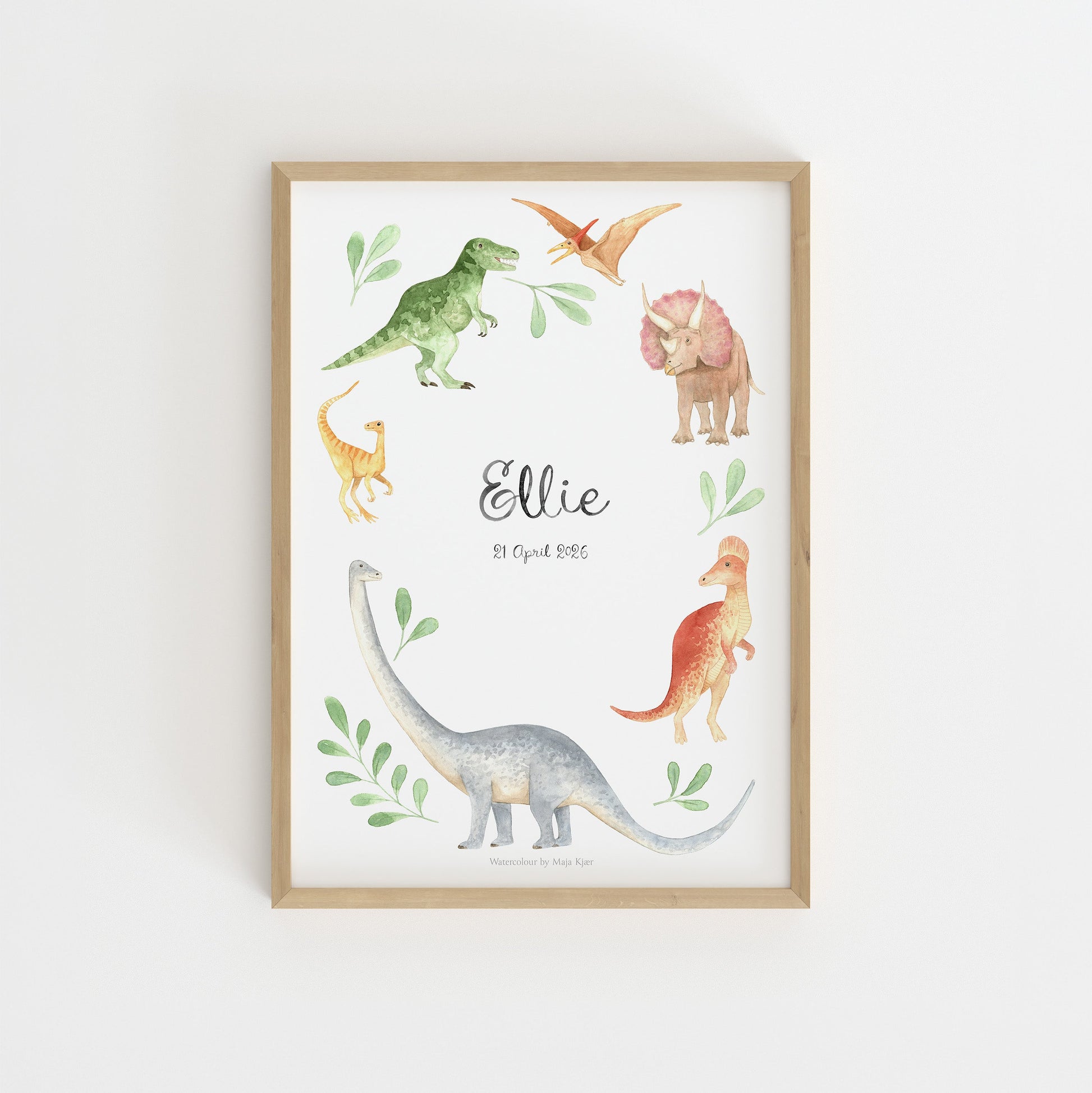 Framed print with dinosaur illustrations on a white wall