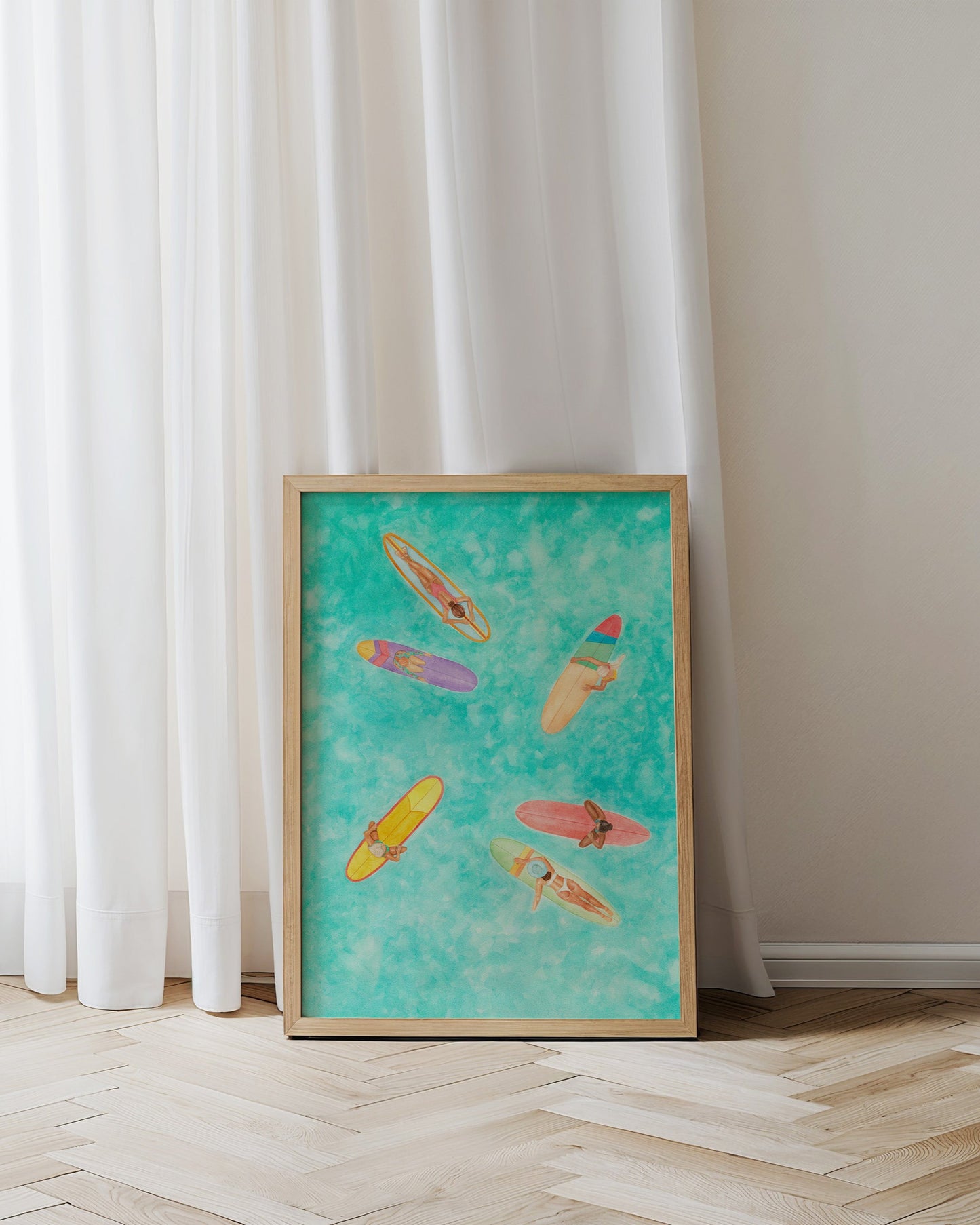 Framed artwork of colorful kayaks on a blue background against a white curtain.