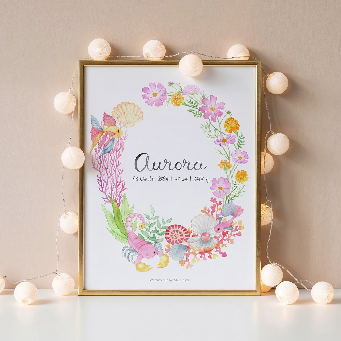 Framed children's name poster with zodiac sign Pisces in pink and purple tones, personalised with name and birth details, surrounded by string lights on a neutral wall.