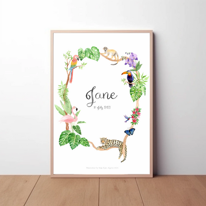 Jungle name poster in oak frame against white wall. Watercolour print with jungle animals like jaguar and hornbill in lush greenery 