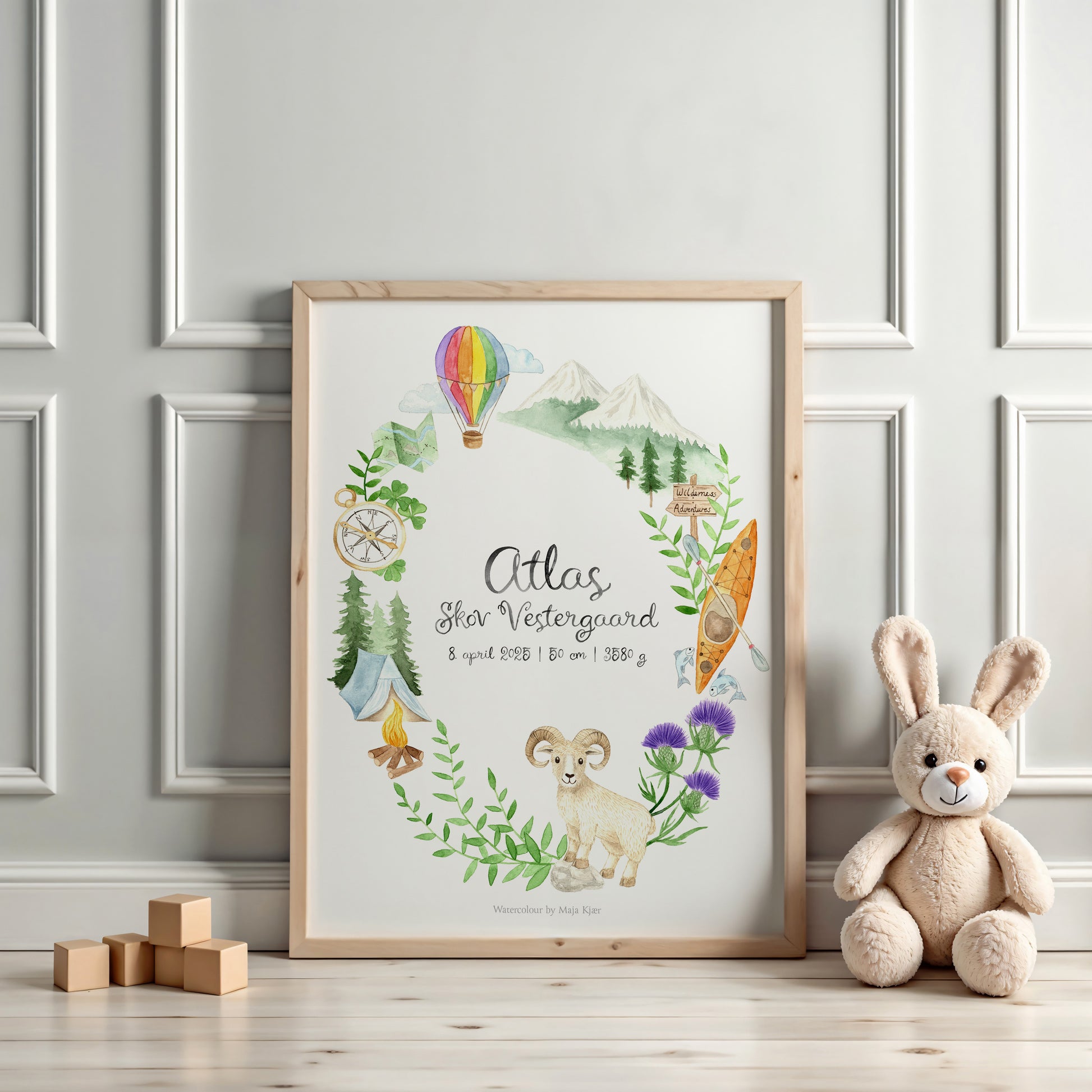 Framed children's zodiac print for Aries with nature-themed illustrations on a wall with a teddy bear and blocks.