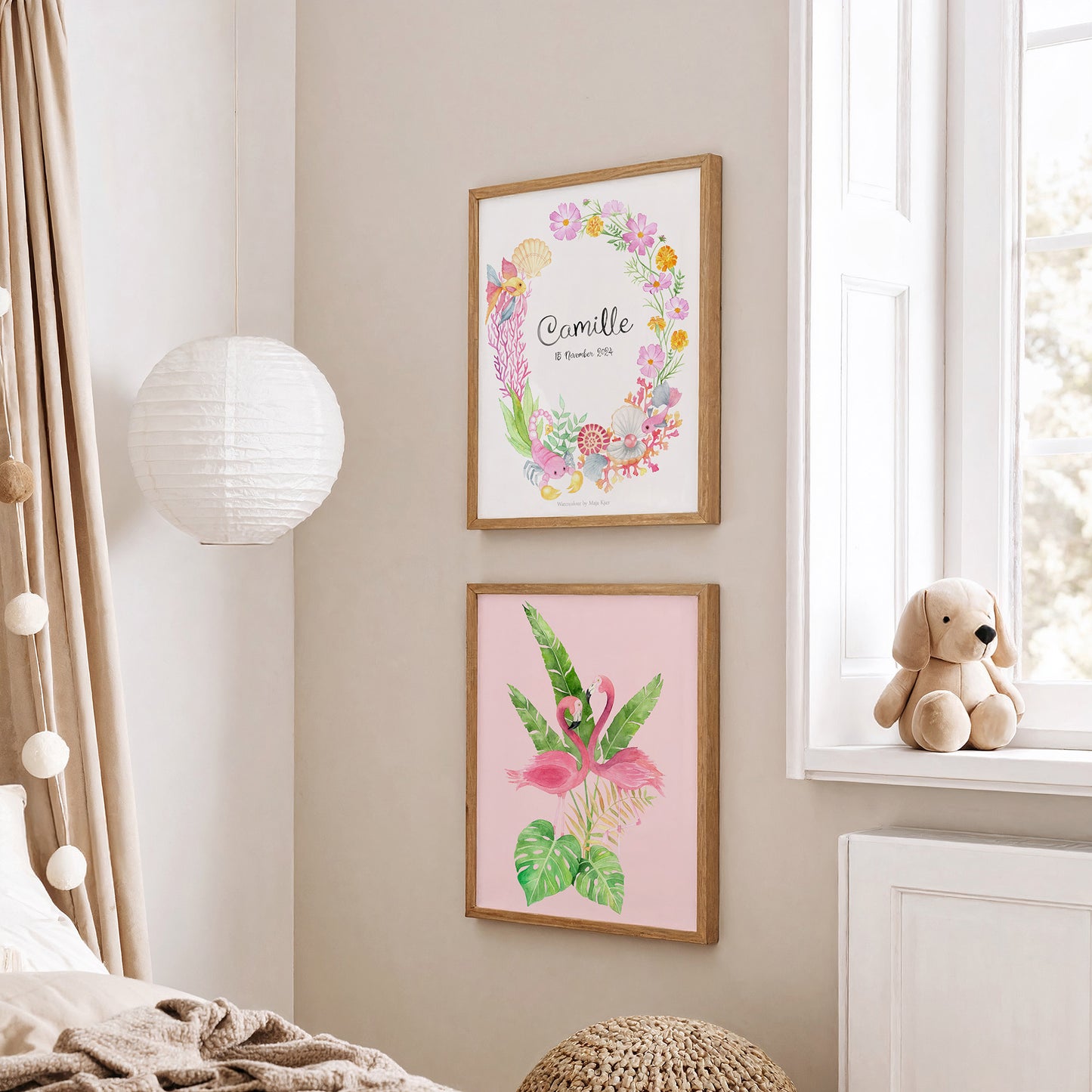 Two framed watercolour posters with personalised zodiac sign and pink flamingos in girls' nursery on a wall with a teddy bear on a windowsill.