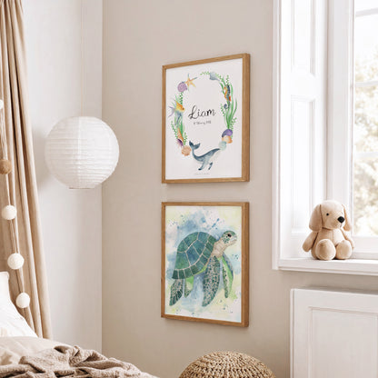 Framed artwork of a turtle and text on a wall with a teddy bear on a windowsill.